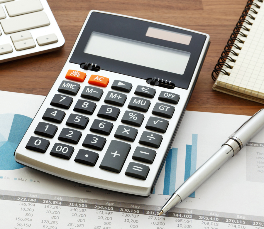 A calculator on top of paper.